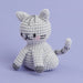 Crocheted cat toy on a light purple background