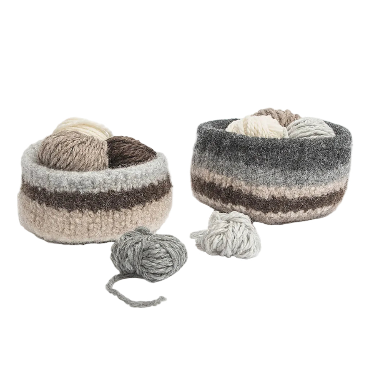 Two round crocheted yarn baskets in neutral tones of gray, beige, and brown, displayed on a clean white background with loose balls of yarn in front.